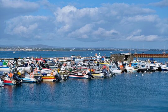 Fishing boats off the island of Culatra. It protects the Ria Formosa lagoon landscape between the islands and the mainland. Algarve, Portugal