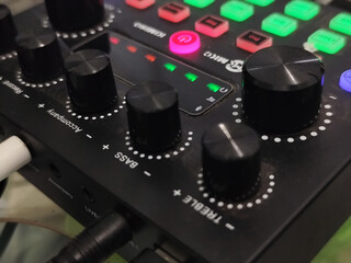 The soundcard is active with multicolored lights, photographed from close range.
