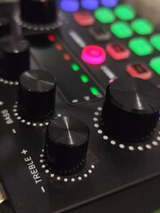 The soundcard is active with multicolored lights, photographed from close range.