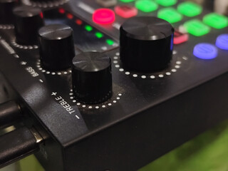 The soundcard is active with multicolored lights, photographed from close range.