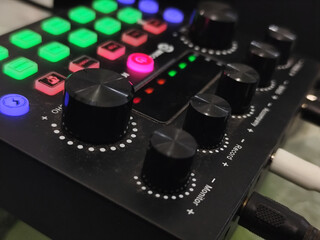 The soundcard is active with multicolored lights, photographed from close range.