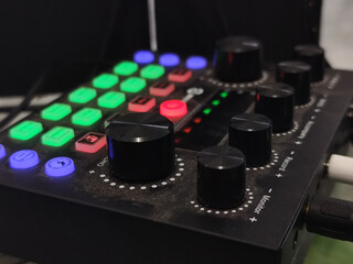 The soundcard is active with multicolored lights, photographed from close range.