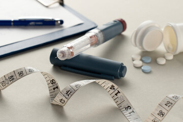 Diabetes Management with Insulin Pen, Medication, and Measuring Tape