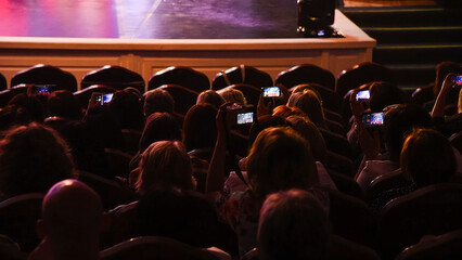 The people enjoying the singer on the stage