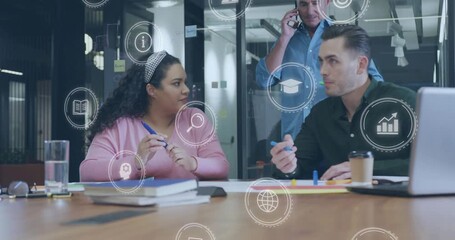Woman in pink tapping pen and causing data icons while colleagues collaborating on business laptop - Powered by Adobe