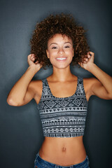 Fototapeta na wymiar Beauty, hair care and portrait of black woman in studio with mockup space for natural hairstyle. Happy, wellness and African female person with shiny afro for salon treatment by gray background.