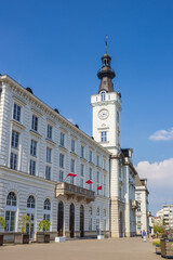 Historic building with white clock tower in Warsaw, Poland