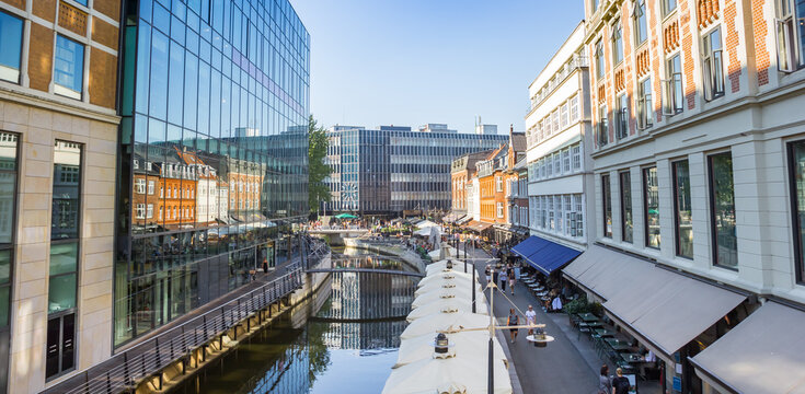 Panorama of the modern inner city with canal and shops in Aarhus, Denmark