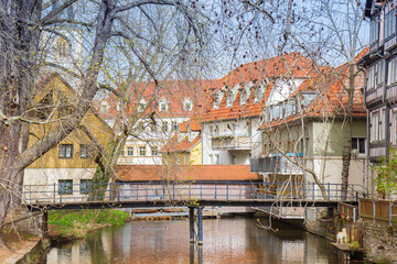 Pedestrian bridge in front of the historic water mill of Erfurt, Germany