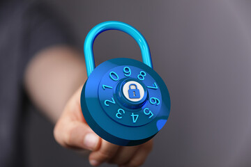 Hand holding digital blue padlock representing security, safety, and protection in the digital world. Safeguard