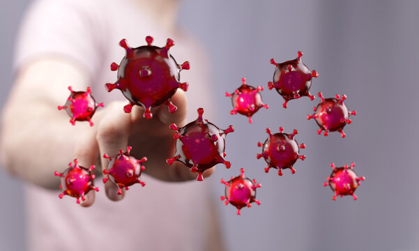 Image depicting a hand touching red virus cells, symbolizing the concept of a virus or disease with a medical,