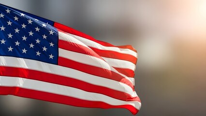 Waving american flag in the sunlight with blurred background