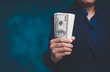 Hand holding cash money for finance and business concept.