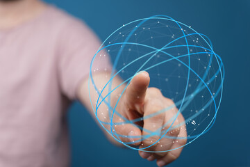 A hand touching a digital globe, representing connection, global network, and innovative technology. Ideal for concepts of communication and fut