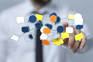 Abstract image showing a hand interacting with a network of colorful speech bubbles, symbolizing communication