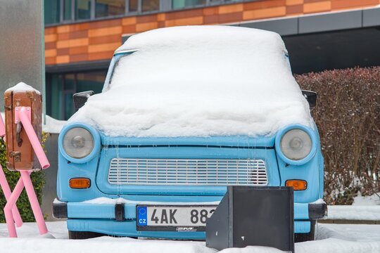 Blue Trabant 601 snowed in winter Prague, nostalgia of communism and DDR