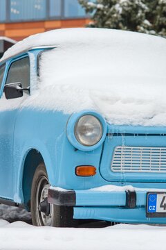 Blue Trabant 601 snowed in winter Prague, nostalgia of communism and DDR