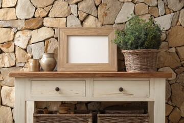 Rustic wooden console table displays decorative items against a natural stone wall backdrop