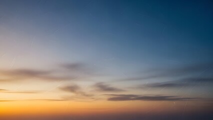 Obraz premium Beautiful Gradient Sky at Dusk with Clouds and a Warm Golden Glow Illuminating the Horizon Minimalist Composition Serene Atmospheric Background Scratches on the Image