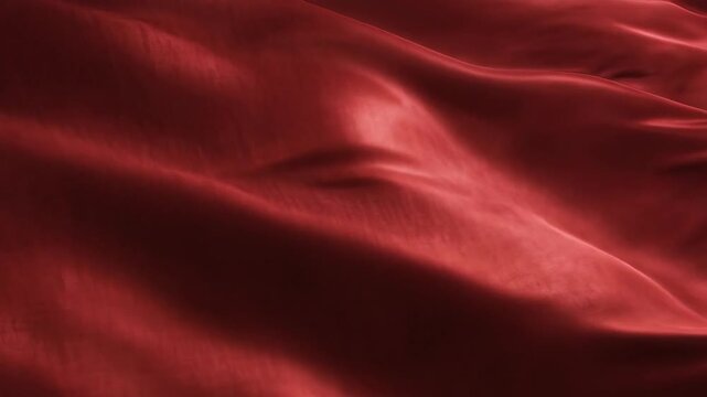 Abstract red fabric texture with soft folds and elegant surface
