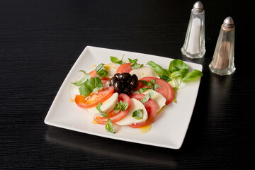 A plate of tomatoes and mozzarella