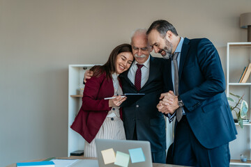 Senior Businessman with Son and Daughter in Modern Office – Family Business Transition © Vladimir Borovic