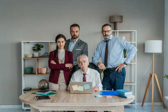 Multi-Generational Family Business Team Portrait in Modern Office &ndash; Serious Expression Family Firm