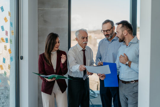 Multi-Generational Business Team Working Together in Modern Office &ndash; Mixed Generations