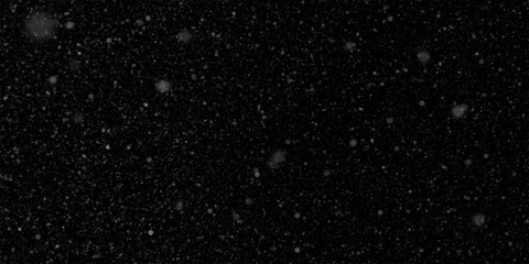 Fototapeta premium Snowflakes falling on a black background, isolated snowfall effect, festive Christmas background, white snow overlay for photo editing. PNG format. Realistic winter atmosphere