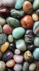 Gorgeous detailed pastel precious stones. Serene background of pastel rounded pebbles. Top view of different colorful natural gem stones crystals