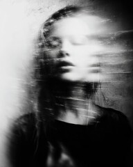 Ghostly young woman experiencing internal psychological turmoil and motion blur