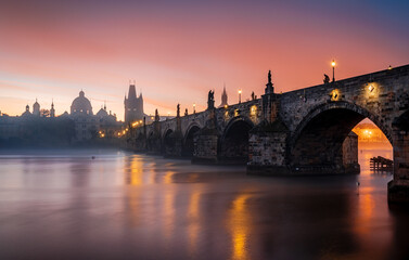 Fototapeta premium city prague river bridge europe night castle architecture sunset church water town travel tower stockholm reflection building czech old panorama winter skyline cathedral sky light fog, dawn, autumn