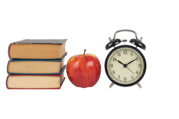 Books, apple, and alarm clock stack isolated on a transparent background