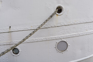 ship side and mooring rope, detail