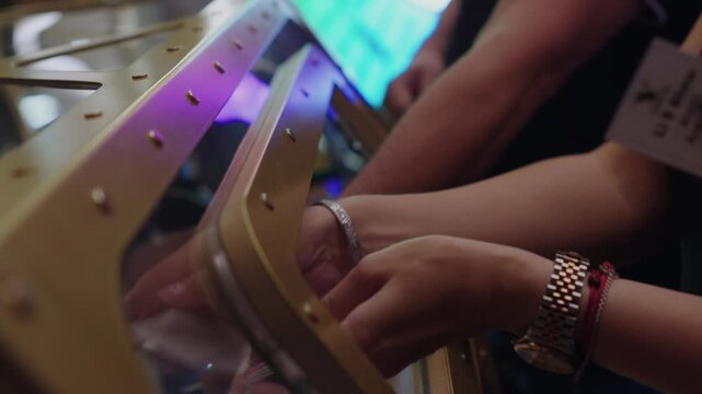 A lottery drum with numbers. The process of drawing prizes, extracting winning numbers, a lottery drum with bingo. A fortune lottery drum for determining the winner. Luck and fortune. A woman's hands 