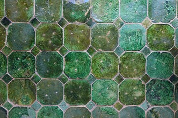 Moroccan green ceramic tiles background. Majolica rustic tile pattern.