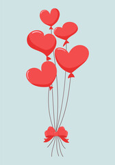 Red heart balloons with a red bow for Valentine's Day.
