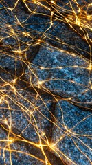 Close-up view of golden, threadlike fibers weaving across a deep azure textured background, resembling neurons