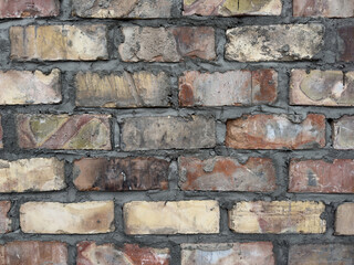 Old brick wall construction close up. Grunge masonry surface. Building exterior texture for abstract background or pattern design.