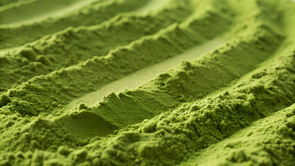 Flowing textured surface of green matcha powder creates a dynamic, natural background perfect for health, food, or branding visuals.