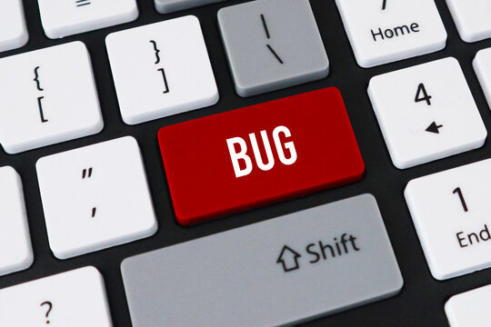 Red bug button on computer keyboard. Concept of software error, system glitch and technical programming issue.