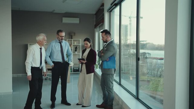 Multi-Generational Business Team Discussing Problem in Modern Office &ndash; Business Conflict