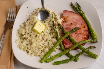 ham with roasted  asparagus and mash pot top with herbs