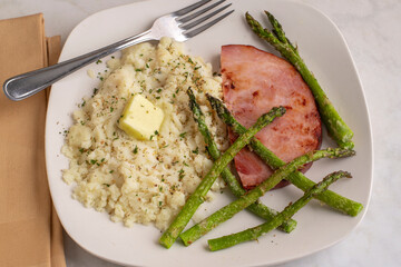 ham with roasted  asparagus and mash pot top with herbs