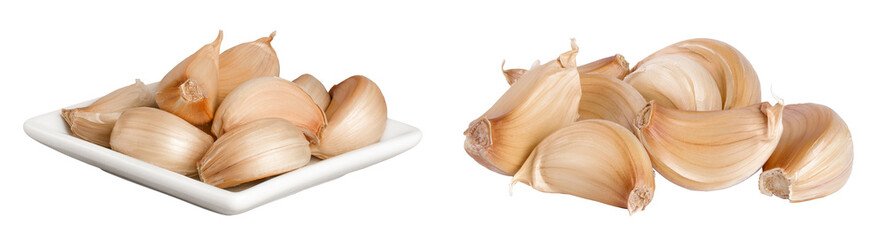garlic cloves in ceramic bowl isolated on white background close up