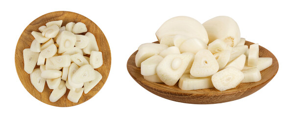 garlic cloves slices in wooden bowl isolated on white background close up. Top view. Flat lay.