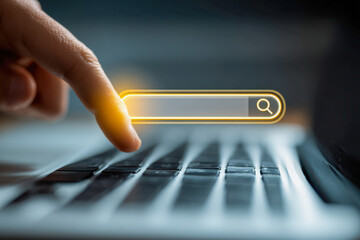 Person using finger to activate glowing search bar interface on laptop keyboard symbolizing online research and digital technology concepts