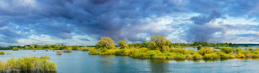 Panoramic View Countryside Landscape During Spring Flood Floodwaters. Tranquil Bold Bright Blue Sky...