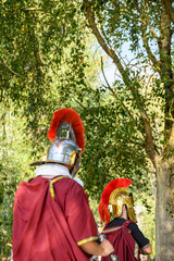 Two roman centurions with red crested helmets the concept of leadership