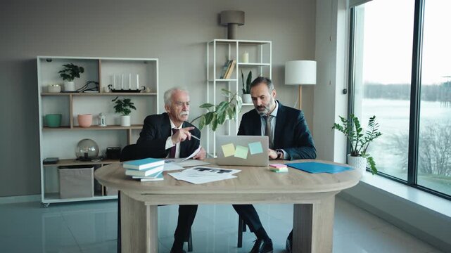 Senior and Middle Aged Businessmen Working in Modern Office &ndash; Father and Son